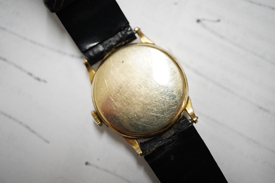 A boy's size 1940's 10k gold filled Longines manual wind wrist watch, with Arabic dial and subsidiary seconds cased and timed in the U.S.A., case diameter 28mm, movement c.10L, on an associated leather strap.